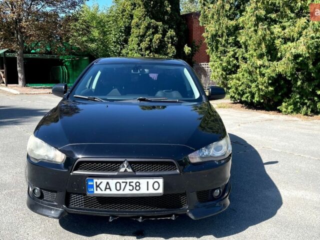Чорний Міцубісі Lancer, об'ємом двигуна 2 л та пробігом 205 тис. км за 7000 $, фото 1 на Automoto.ua