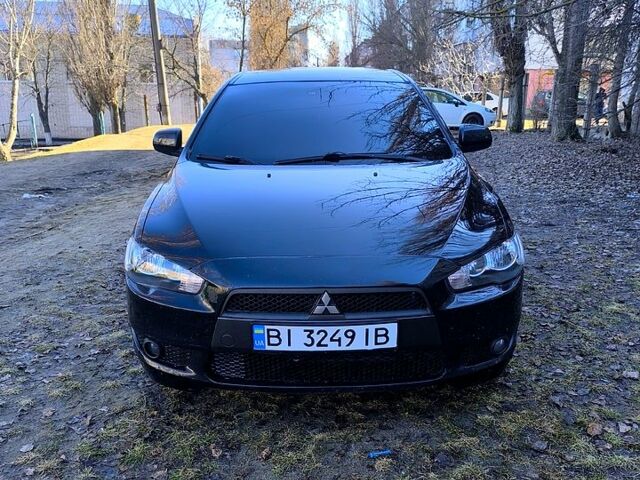 Черный Мицубиси Лансер, объемом двигателя 2 л и пробегом 217 тыс. км за 7900 $, фото 1 на Automoto.ua