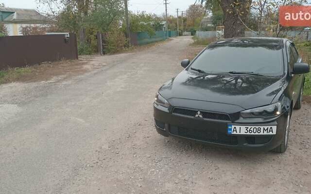 Чорний Міцубісі Lancer, об'ємом двигуна 1.5 л та пробігом 243 тис. км за 5200 $, фото 1 на Automoto.ua