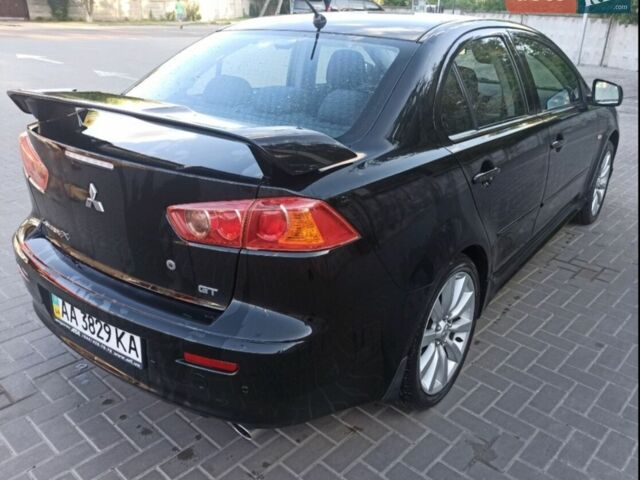 Чорний Міцубісі Lancer, об'ємом двигуна 2 л та пробігом 220 тис. км за 7999 $, фото 1 на Automoto.ua