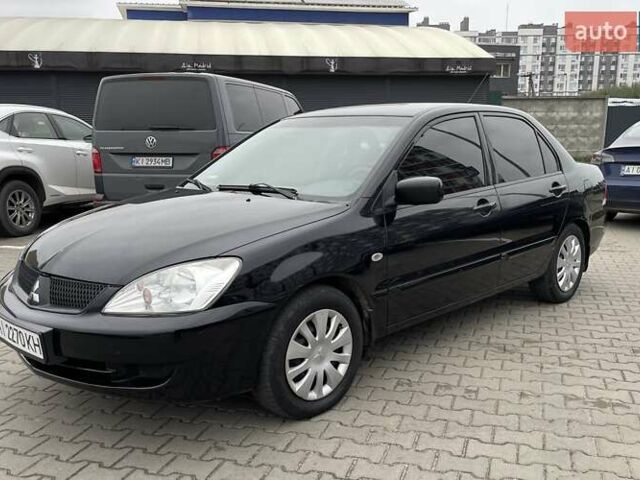 Чорний Міцубісі Lancer, об'ємом двигуна 1.6 л та пробігом 186 тис. км за 5500 $, фото 1 на Automoto.ua