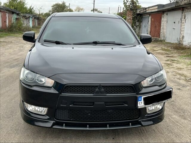 Чорний Міцубісі Lancer, об'ємом двигуна 2 л та пробігом 203 тис. км за 6976 $, фото 1 на Automoto.ua