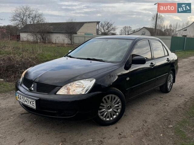 Чорний Міцубісі Lancer, об'ємом двигуна 1.6 л та пробігом 165 тис. км за 3900 $, фото 1 на Automoto.ua
