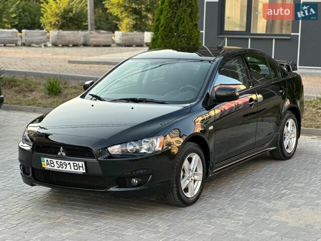 Чорний Міцубісі Lancer, об'ємом двигуна 2 л та пробігом 13 тис. км за 11800 $, фото 1 на Automoto.ua