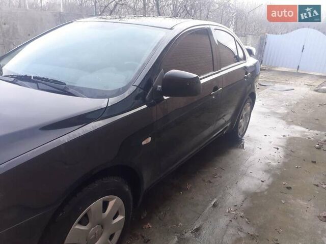 Чорний Міцубісі Lancer, об'ємом двигуна 1.5 л та пробігом 103 тис. км за 7048 $, фото 1 на Automoto.ua