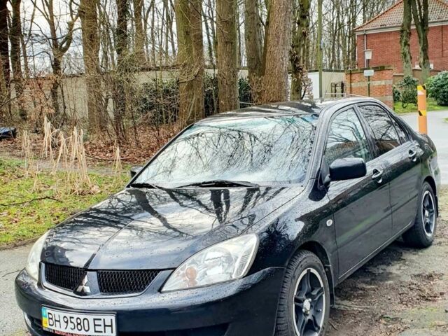 Чорний Міцубісі Lancer, об'ємом двигуна 1.6 л та пробігом 73 тис. км за 8500 $, фото 1 на Automoto.ua