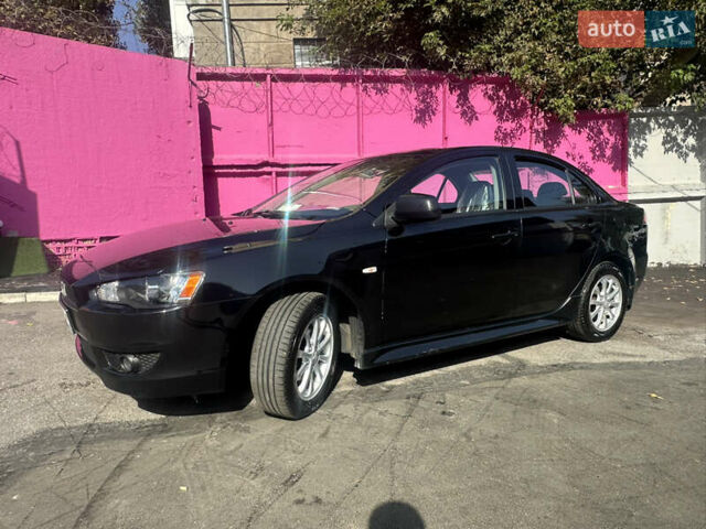 Черный Мицубиси Лансер, объемом двигателя 2 л и пробегом 158 тыс. км за 10800 $, фото 1 на Automoto.ua