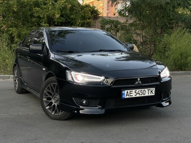 Чорний Міцубісі Lancer, об'ємом двигуна 2 л та пробігом 150 тис. км за 7815 $, фото 1 на Automoto.ua