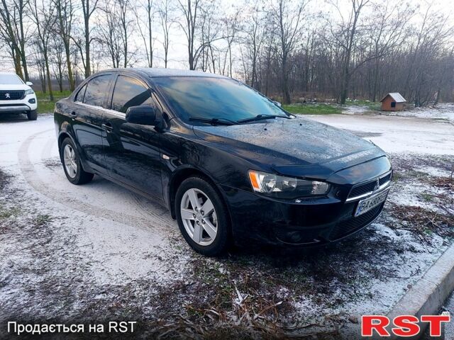 Чорний Міцубісі Lancer, об'ємом двигуна 1.8 л та пробігом 180 тис. км за 6799 $, фото 1 на Automoto.ua