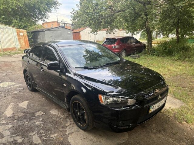 Чорний Міцубісі Lancer, об'ємом двигуна 2 л та пробігом 106 тис. км за 7495 $, фото 1 на Automoto.ua