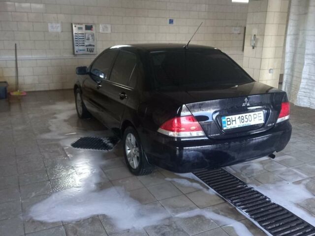 Чорний Міцубісі Lancer, об'ємом двигуна 1.6 л та пробігом 150 тис. км за 7500 $, фото 1 на Automoto.ua