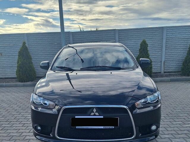Чорний Міцубісі Lancer, об'ємом двигуна 1.6 л та пробігом 111 тис. км за 8700 $, фото 1 на Automoto.ua