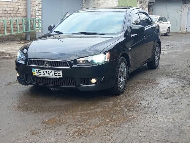 Черный Мицубиси Лансер, объемом двигателя 1.6 л и пробегом 102 тыс. км за 6500 $, фото 1 на Automoto.ua