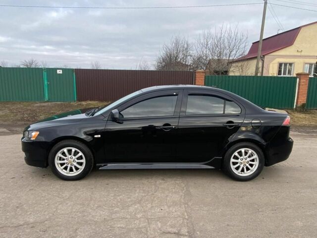 Чорний Міцубісі Lancer, об'ємом двигуна 2 л та пробігом 50 тис. км за 8300 $, фото 1 на Automoto.ua