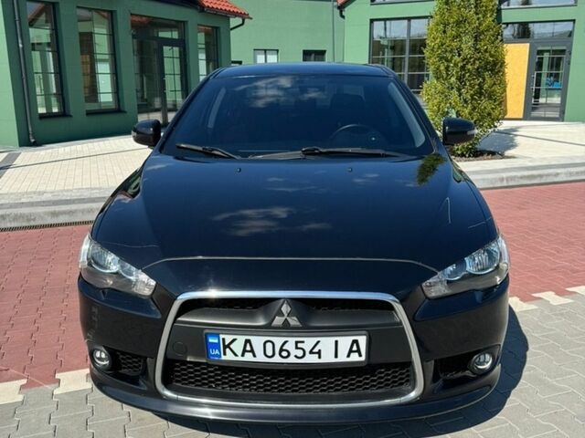 Черный Мицубиси Лансер, объемом двигателя 1.59 л и пробегом 130 тыс. км за 10000 $, фото 1 на Automoto.ua