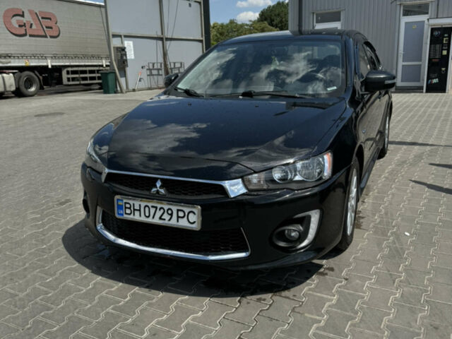 Чорний Міцубісі Lancer, об'ємом двигуна 2 л та пробігом 134 тис. км за 9000 $, фото 1 на Automoto.ua
