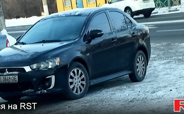 Чорний Міцубісі Lancer, об'ємом двигуна 2 л та пробігом 12800 тис. км за 9000 $, фото 1 на Automoto.ua