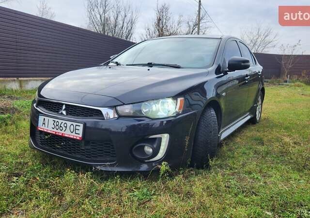 Чорний Міцубісі Lancer, об'ємом двигуна 2 л та пробігом 127 тис. км за 9600 $, фото 1 на Automoto.ua