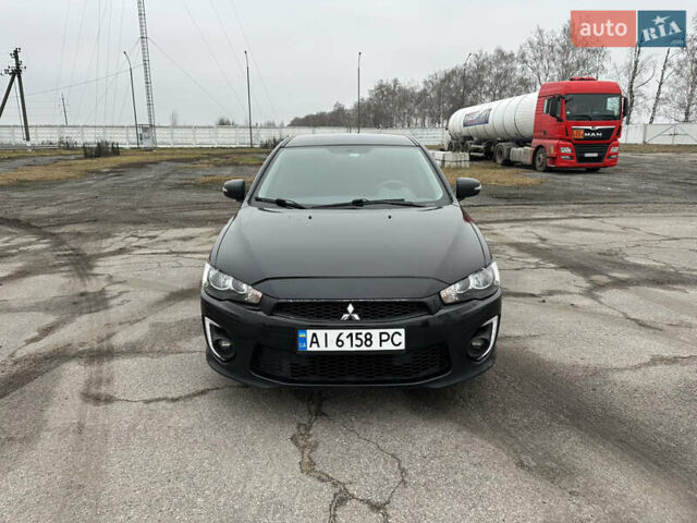 Черный Мицубиси Лансер, объемом двигателя 2 л и пробегом 142 тыс. км за 9500 $, фото 1 на Automoto.ua