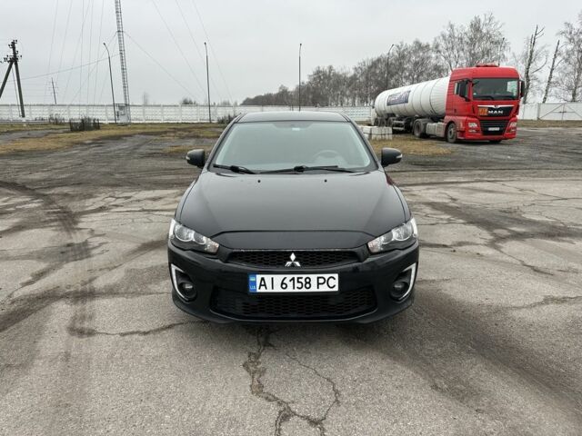 Черный Мицубиси Лансер, объемом двигателя 2 л и пробегом 149 тыс. км за 9200 $, фото 1 на Automoto.ua