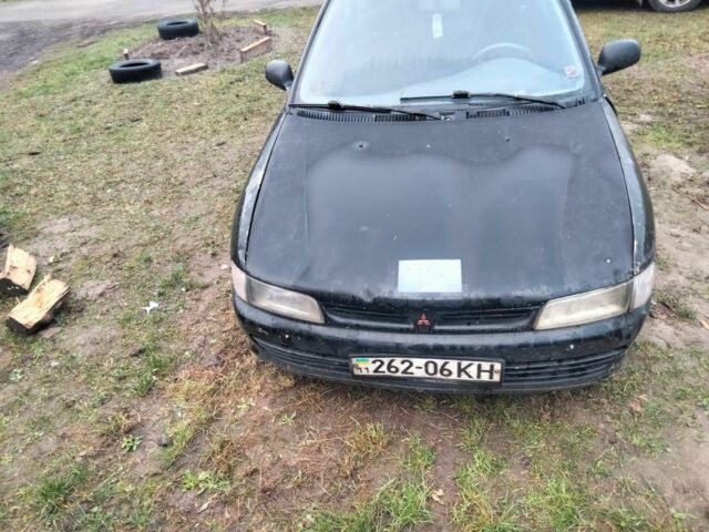 Черный Мицубиси Лансер, объемом двигателя 2 л и пробегом 380 тыс. км за 800 $, фото 1 на Automoto.ua