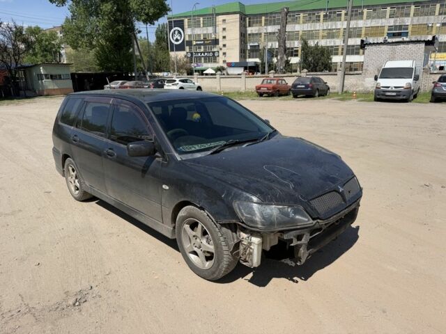 Черный Мицубиси Лансер, объемом двигателя 1.8 л и пробегом 235 тыс. км за 1050 $, фото 1 на Automoto.ua