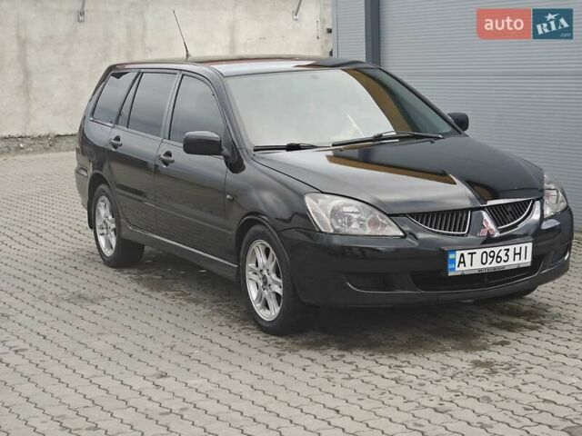 Черный Мицубиси Лансер, объемом двигателя 1.6 л и пробегом 591 тыс. км за 3300 $, фото 1 на Automoto.ua