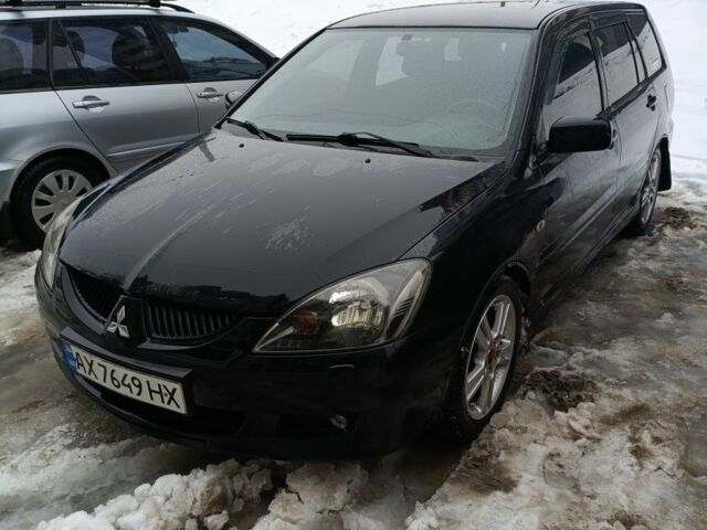 Чорний Міцубісі Lancer, об'ємом двигуна 2 л та пробігом 355 тис. км за 4300 $, фото 1 на Automoto.ua