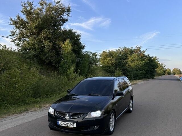 Черный Мицубиси Лансер, объемом двигателя 2 л и пробегом 295 тыс. км за 4100 $, фото 1 на Automoto.ua