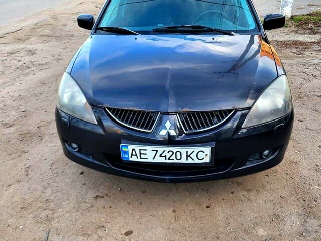 Чорний Міцубісі Lancer, об'ємом двигуна 1.6 л та пробігом 290 тис. км за 1999 $, фото 1 на Automoto.ua