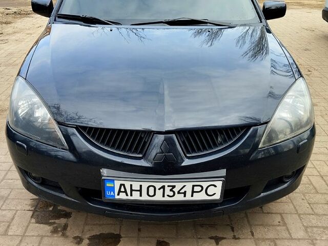 Чорний Міцубісі Lancer, об'ємом двигуна 2 л та пробігом 231 тис. км за 5350 $, фото 1 на Automoto.ua