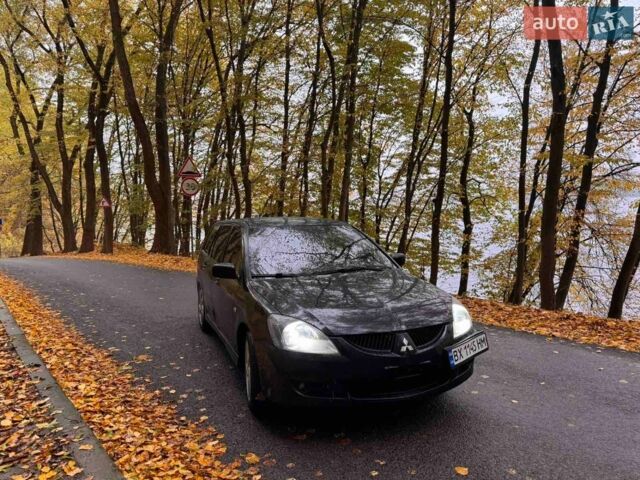 Чорний Міцубісі Lancer, об'ємом двигуна 2 л та пробігом 296 тис. км за 5100 $, фото 1 на Automoto.ua