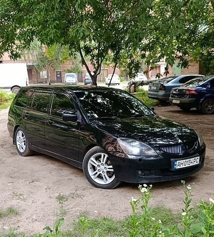 Черный Мицубиси Лансер, объемом двигателя 2 л и пробегом 236 тыс. км за 4499 $, фото 1 на Automoto.ua