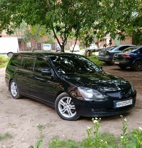 Чорний Міцубісі Lancer, об'ємом двигуна 2 л та пробігом 236 тис. км за 3706 $, фото 1 на Automoto.ua