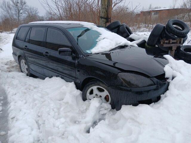 Черный Мицубиси Лансер, объемом двигателя 2 л и пробегом 300 тыс. км за 1650 $, фото 1 на Automoto.ua