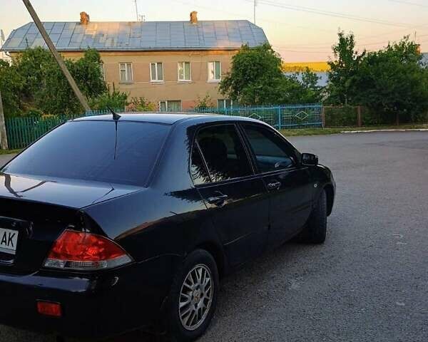 Чорний Міцубісі Lancer, об'ємом двигуна 1.58 л та пробігом 202 тис. км за 2800 $, фото 1 на Automoto.ua