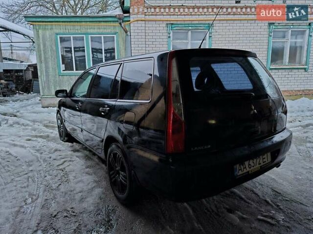 Черный Мицубиси Лансер, объемом двигателя 1.6 л и пробегом 200 тыс. км за 2700 $, фото 1 на Automoto.ua