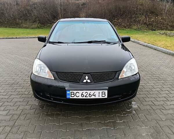 Черный Мицубиси Лансер, объемом двигателя 1.58 л и пробегом 336 тыс. км за 2600 $, фото 1 на Automoto.ua