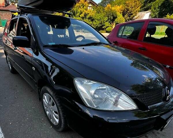 Чорний Міцубісі Lancer, об'ємом двигуна 1.6 л та пробігом 290 тис. км за 4000 $, фото 1 на Automoto.ua