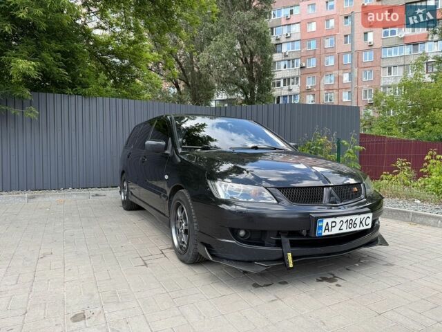Черный Мицубиси Лансер, объемом двигателя 2 л и пробегом 226 тыс. км за 4800 $, фото 1 на Automoto.ua
