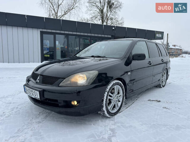 Черный Мицубиси Лансер, объемом двигателя 2 л и пробегом 212 тыс. км за 3950 $, фото 1 на Automoto.ua