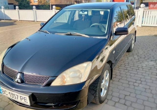 Черный Мицубиси Лансер, объемом двигателя 1.58 л и пробегом 263 тыс. км за 3999 $, фото 1 на Automoto.ua