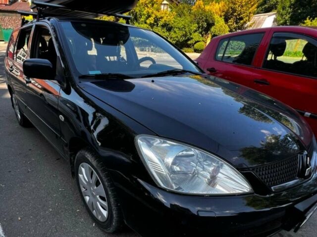 Чорний Міцубісі Lancer, об'ємом двигуна 1.6 л та пробігом 290 тис. км за 3500 $, фото 1 на Automoto.ua