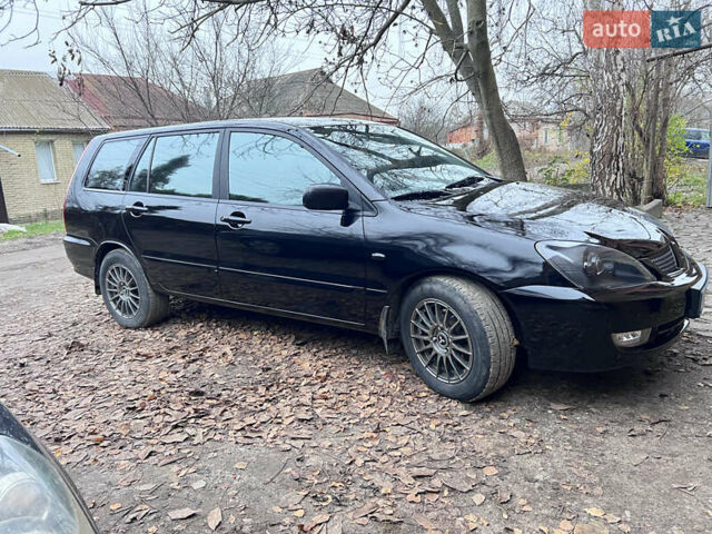 Чорний Міцубісі Lancer, об'ємом двигуна 1.6 л та пробігом 220 тис. км за 5500 $, фото 1 на Automoto.ua