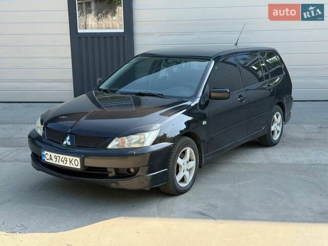 Чорний Міцубісі Lancer, об'ємом двигуна 1.58 л та пробігом 220 тис. км за 3950 $, фото 1 на Automoto.ua