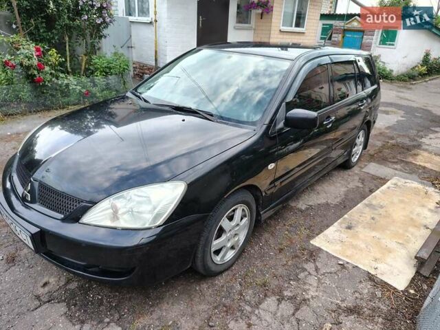 Черный Мицубиси Лансер, объемом двигателя 1.6 л и пробегом 280 тыс. км за 4500 $, фото 1 на Automoto.ua