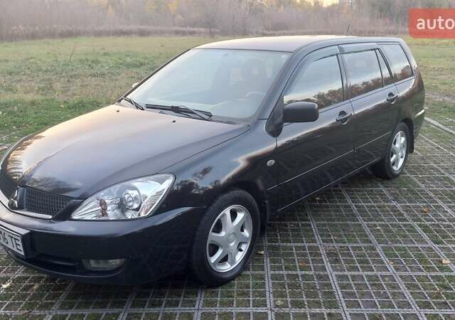 Мицубиси Лансер 2006 в Киеве на Automoto.ua Черный Мицубиси Лансер, объемом двигателя 1.58 л и пробегом 296 тыс. км за 4500 $, фото 1 на Automoto.ua