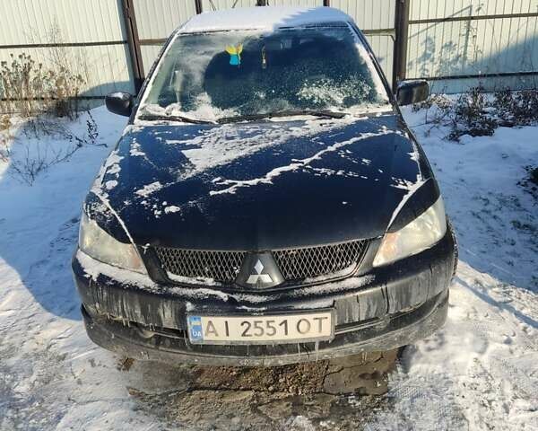 Черный Мицубиси Лансер, объемом двигателя 1.58 л и пробегом 378 тыс. км за 4000 $, фото 1 на Automoto.ua