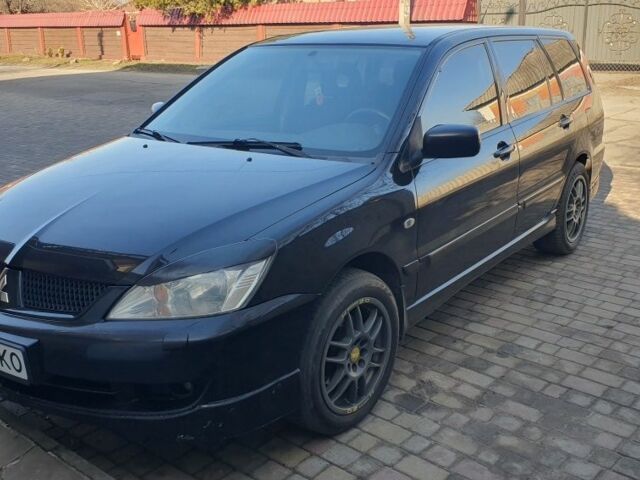 Черный Мицубиси Лансер, объемом двигателя 1.6 л и пробегом 350 тыс. км за 4450 $, фото 1 на Automoto.ua