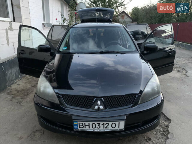 Черный Мицубиси Лансер, объемом двигателя 2 л и пробегом 212 тыс. км за 4500 $, фото 1 на Automoto.ua